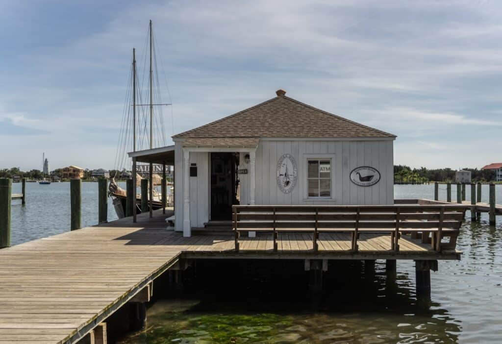 Dockside building with boats and water view.